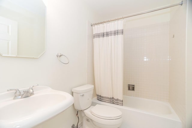 full bathroom featuring toilet, sink, and shower / tub combo