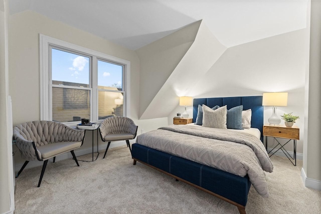 carpeted bedroom with vaulted ceiling