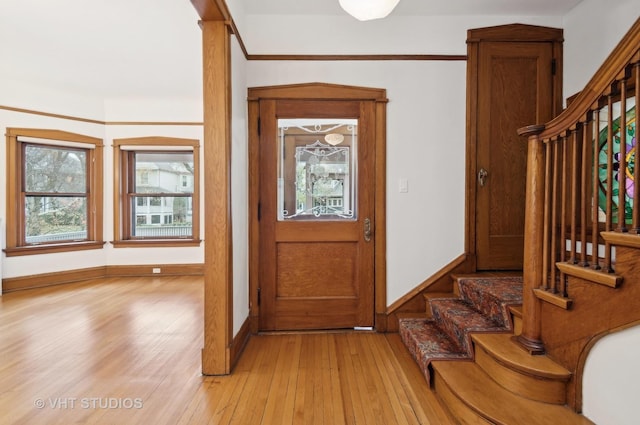 foyer entrance with light hardwood / wood-style flooring