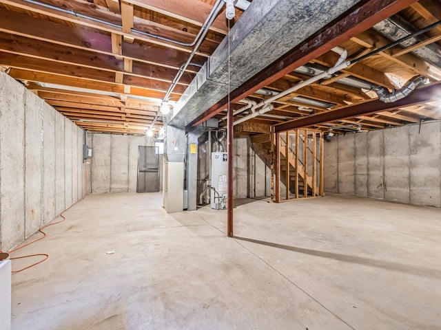 basement featuring heating unit and gas water heater