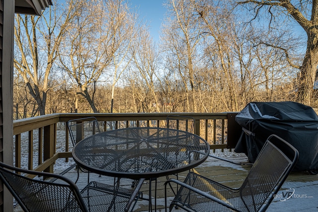 wooden deck with a grill