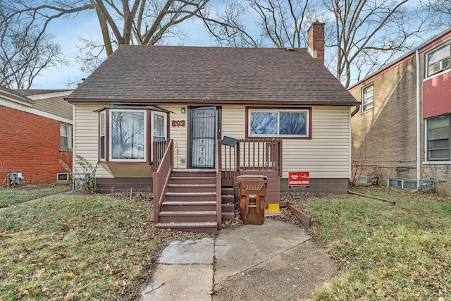 bungalow with a front yard