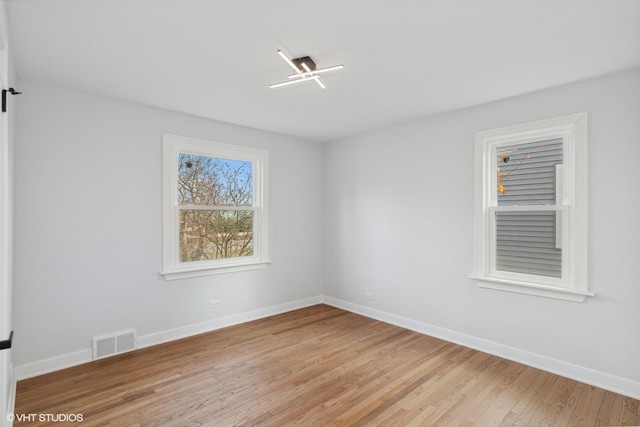 unfurnished room featuring light hardwood / wood-style floors