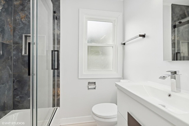 full bathroom with vanity, combined bath / shower with glass door, and toilet