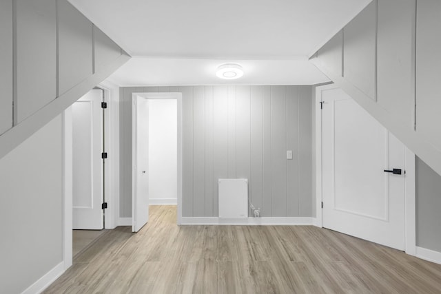 bonus room with light hardwood / wood-style flooring