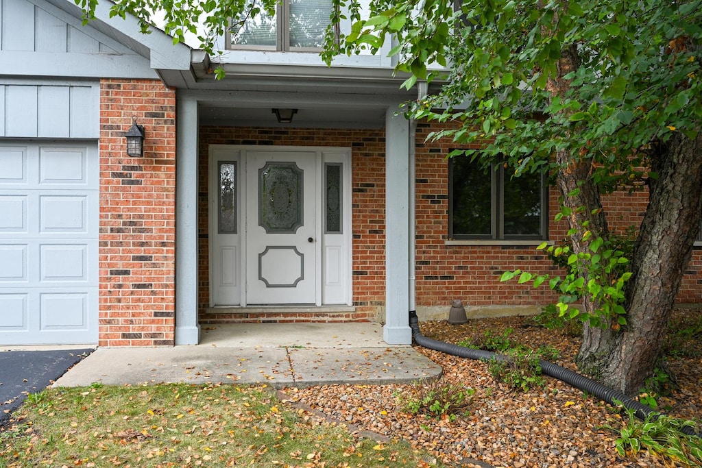 property entrance featuring a garage