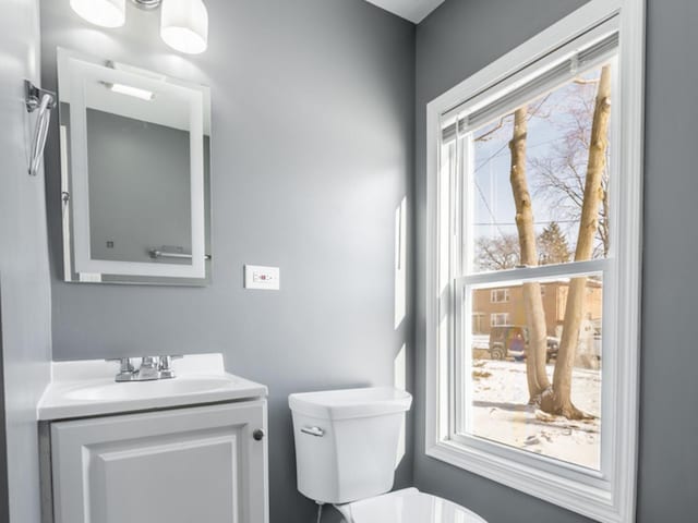 bathroom featuring vanity and toilet