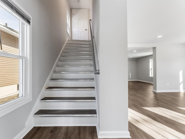 stairs with wood-type flooring