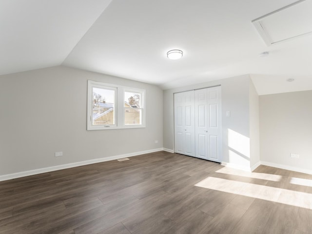 additional living space with lofted ceiling and wood-type flooring