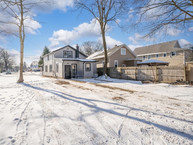 view of snow covered house