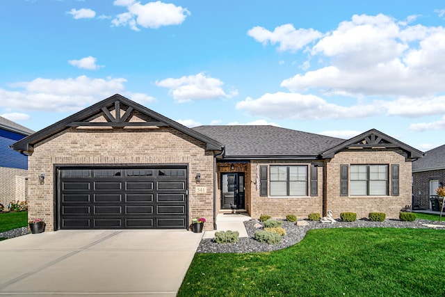 view of front of home featuring a garage and a front yard