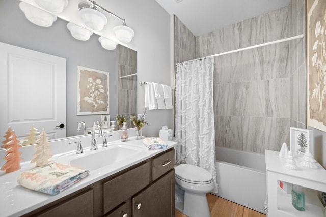 full bathroom featuring toilet, vanity, wood-type flooring, and shower / bath combo