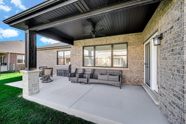 view of patio featuring ceiling fan