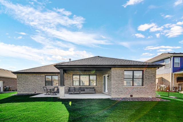 rear view of property featuring an outdoor hangout area, a lawn, and a patio