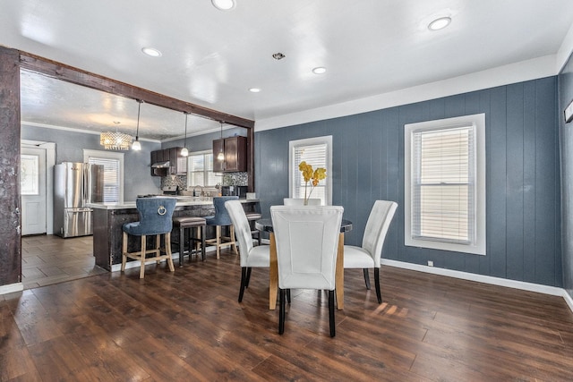 dining space featuring dark hardwood / wood-style floors