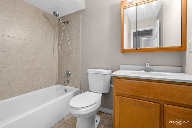 full bathroom featuring toilet, tiled shower / bath combo, tile patterned flooring, and vanity