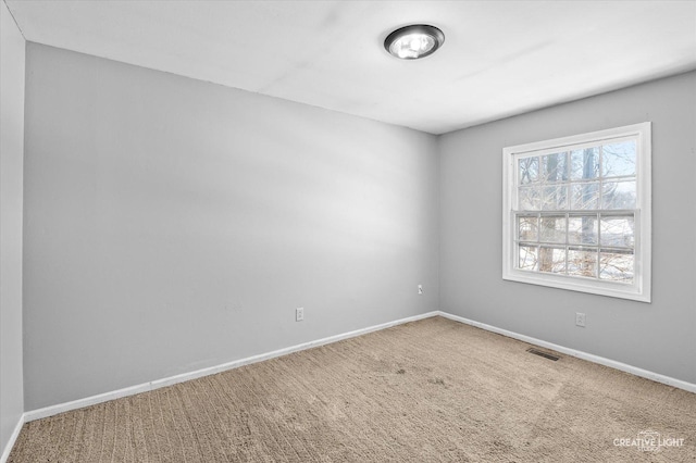 empty room featuring carpet floors