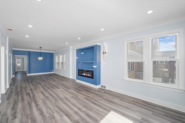 unfurnished living room with dark hardwood / wood-style flooring