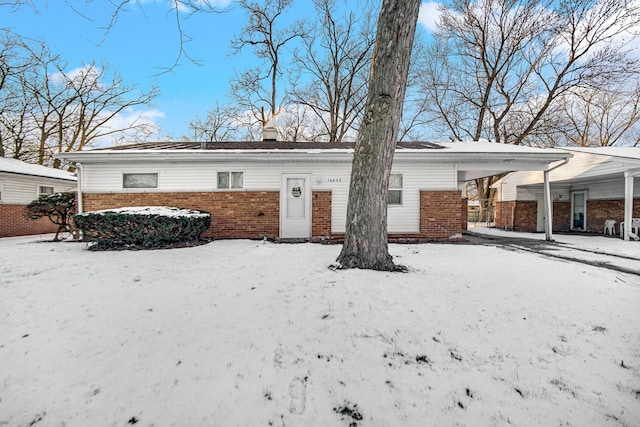 view of snow covered house