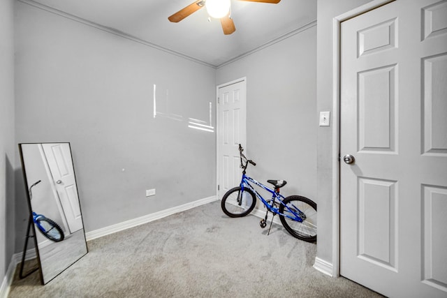 misc room featuring light carpet and ceiling fan