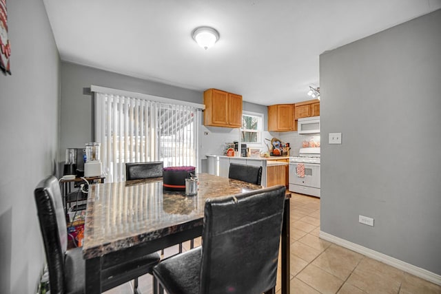 dining room featuring light tile patterned flooring