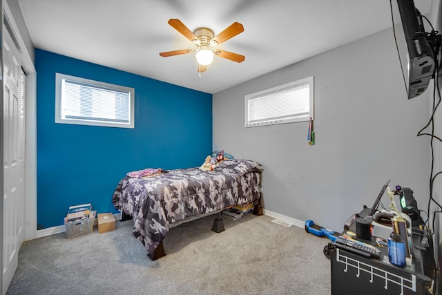 bedroom featuring ceiling fan, carpet floors, and a closet