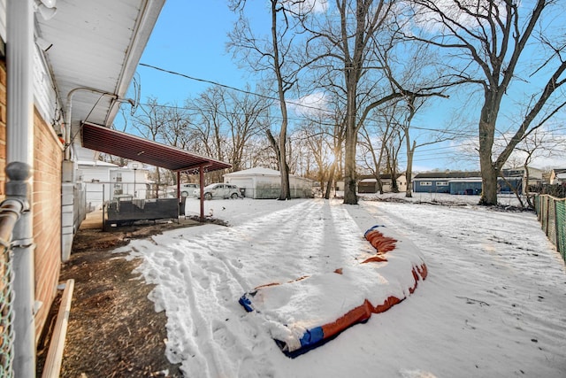 view of yard layered in snow