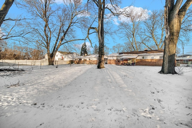 view of yard layered in snow