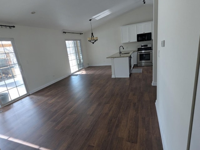 kitchen with dark hardwood / wood-style flooring, stainless steel range, sink, decorative light fixtures, and white cabinetry