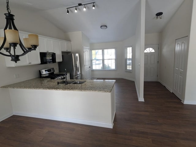 kitchen featuring white cabinets, dark hardwood / wood-style floors, light stone counters, kitchen peninsula, and stainless steel appliances