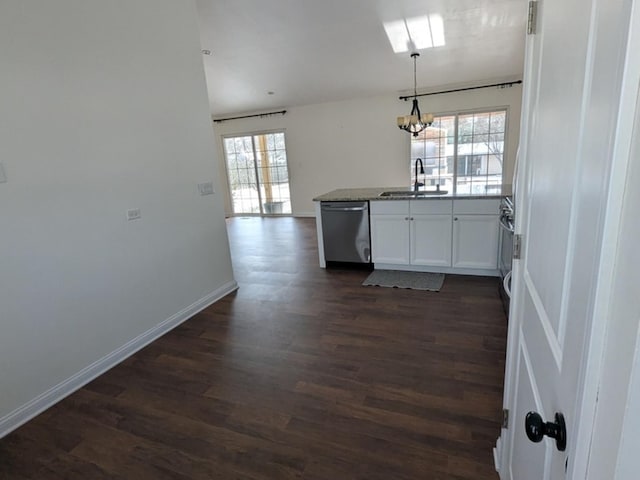 kitchen with dishwasher, white cabinets, plenty of natural light, and sink