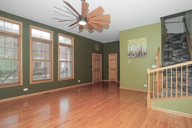 unfurnished room featuring ceiling fan and light hardwood / wood-style flooring