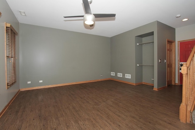 spare room featuring dark hardwood / wood-style floors and ceiling fan