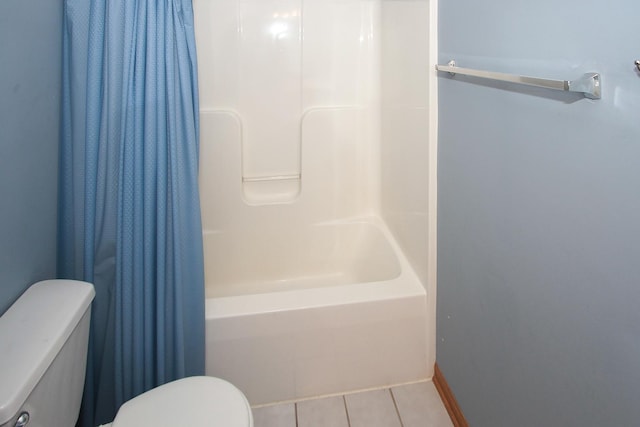 bathroom featuring tile patterned floors, shower / bath combo, and toilet