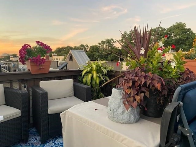 view of balcony at dusk