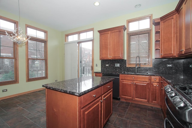 kitchen with sink, backsplash, dark stone counters, a kitchen island, and black appliances