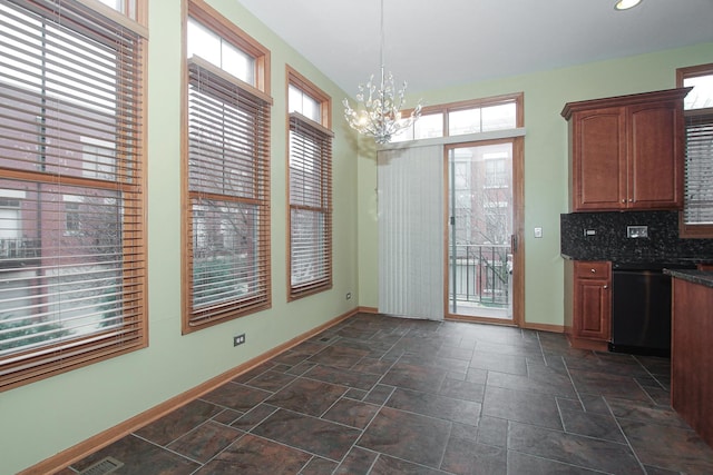 dining space featuring a notable chandelier