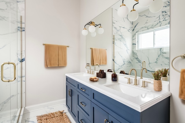 bathroom featuring a shower with door and vanity