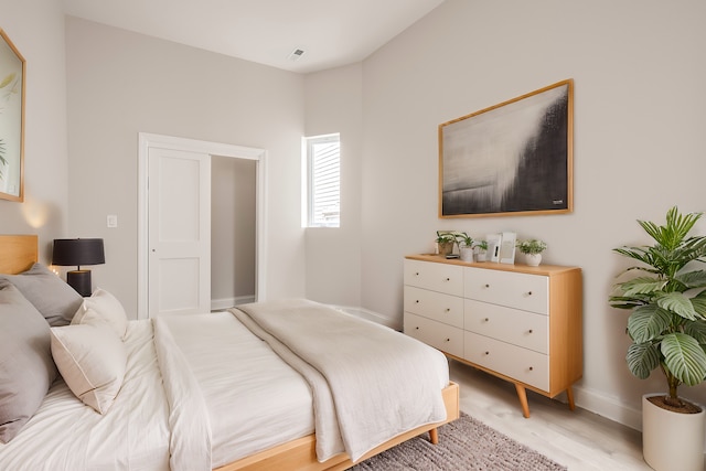 bedroom with light wood-type flooring