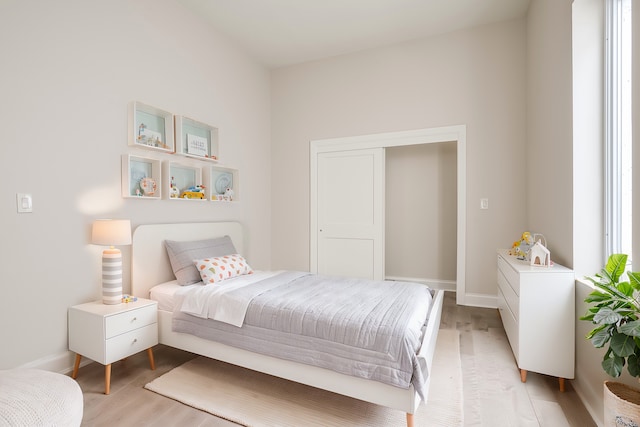 bedroom with light hardwood / wood-style flooring