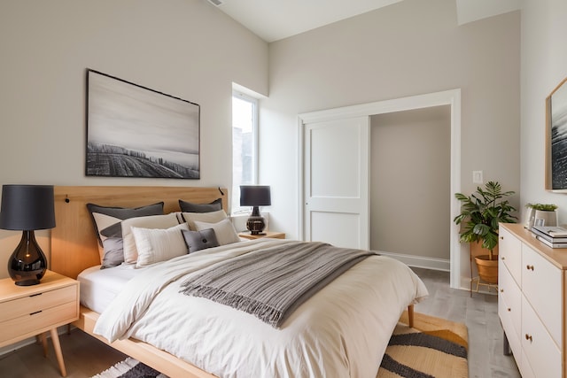 bedroom with light hardwood / wood-style floors