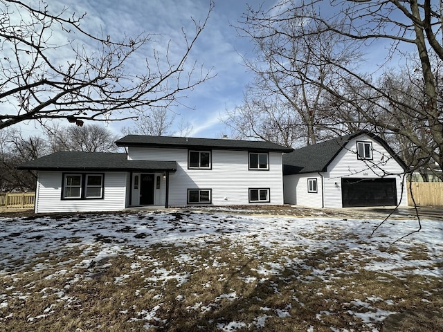 split level home featuring fence