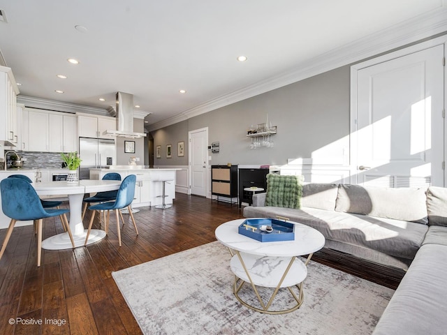 living room featuring crown molding, visible vents, dark wood-style flooring, and recessed lighting