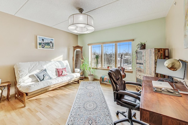 office area featuring hardwood / wood-style floors and a textured ceiling