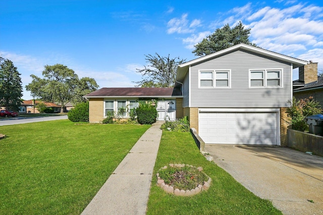 tri-level home featuring a garage and a front yard