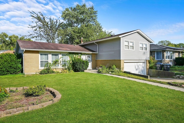 tri-level home featuring a garage and a front lawn