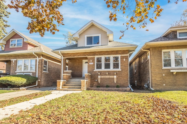 view of front of home with a front yard and a porch