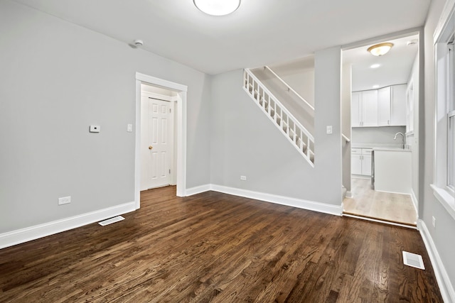 interior space with hardwood / wood-style floors and sink