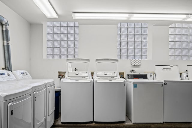 clothes washing area featuring independent washer and dryer