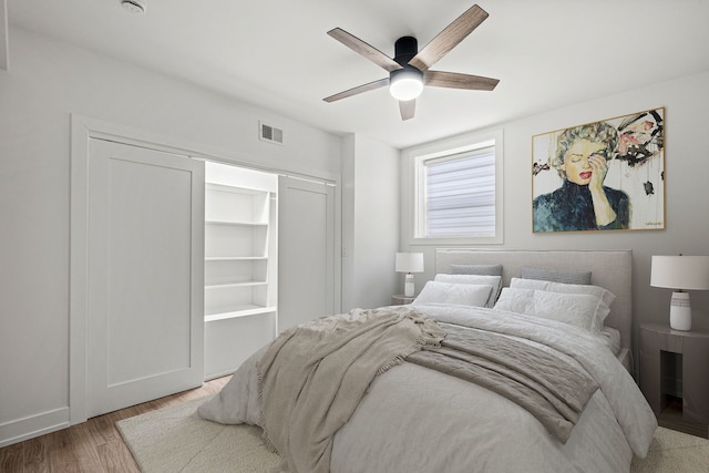 bedroom with ceiling fan and light hardwood / wood-style flooring